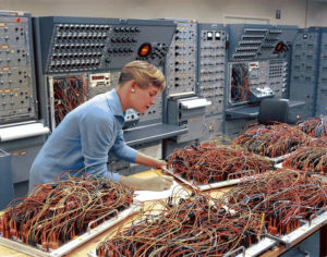 Woman with buckets of computer cables